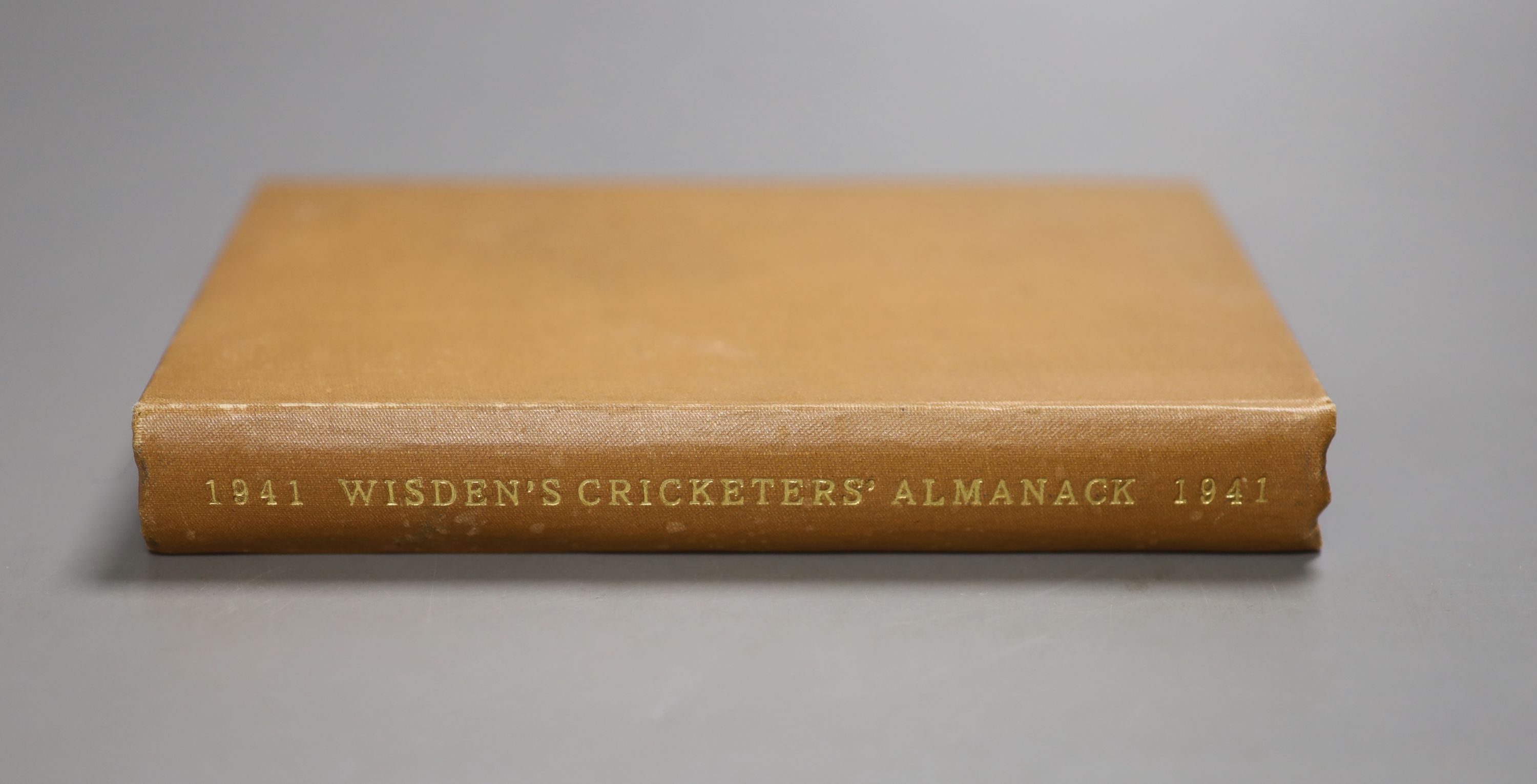 Wisden Cricketer's Almanack, 1941 - pictorial title vignette, photo plates; gilt lettered brown cloth preserving the original pictorial